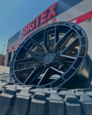 Arena Wheel Co custom wheel displayed in front of BIGTEX Tires & Offroad